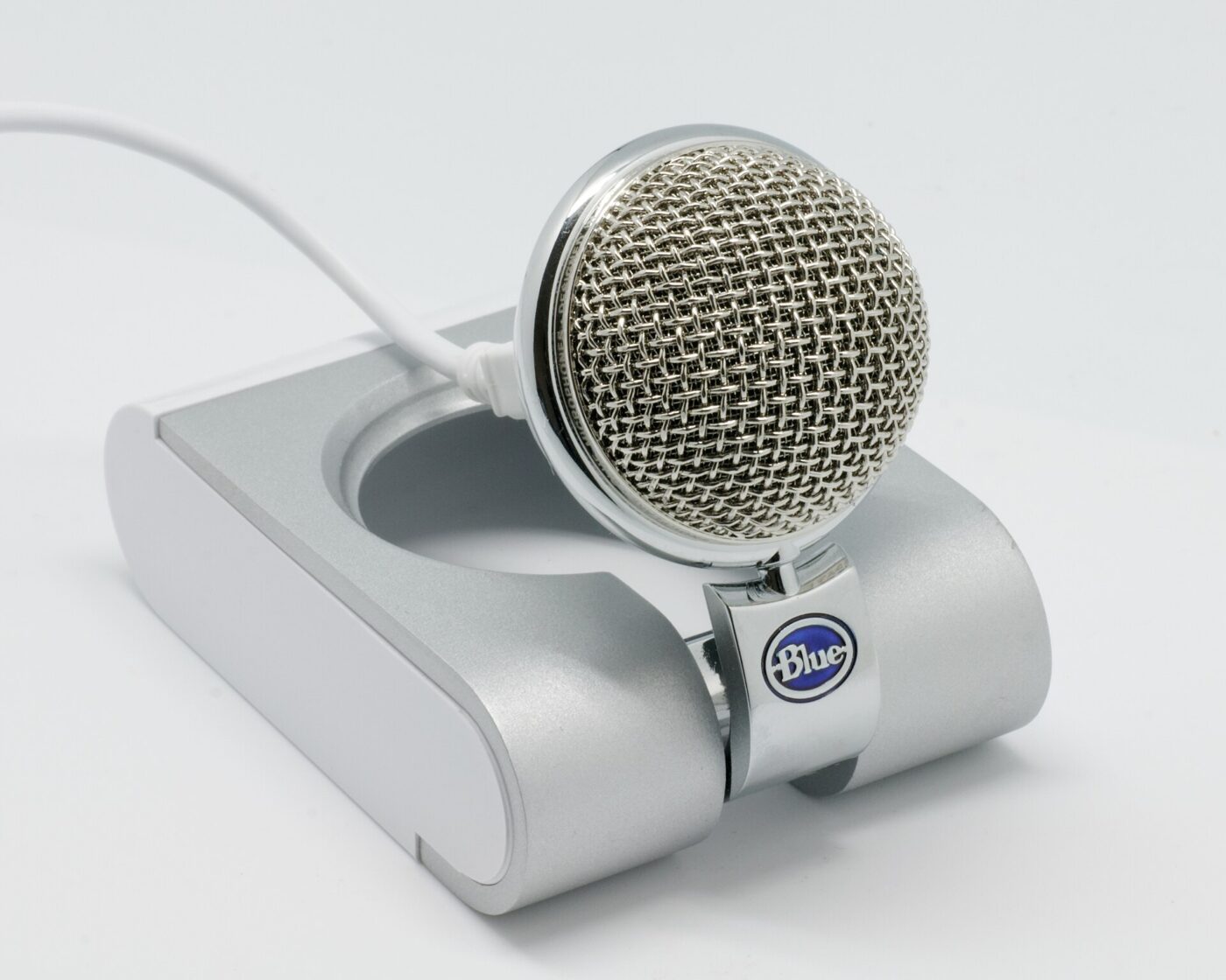 A Blue Snowflake USB desktop microphone on its folding stand.