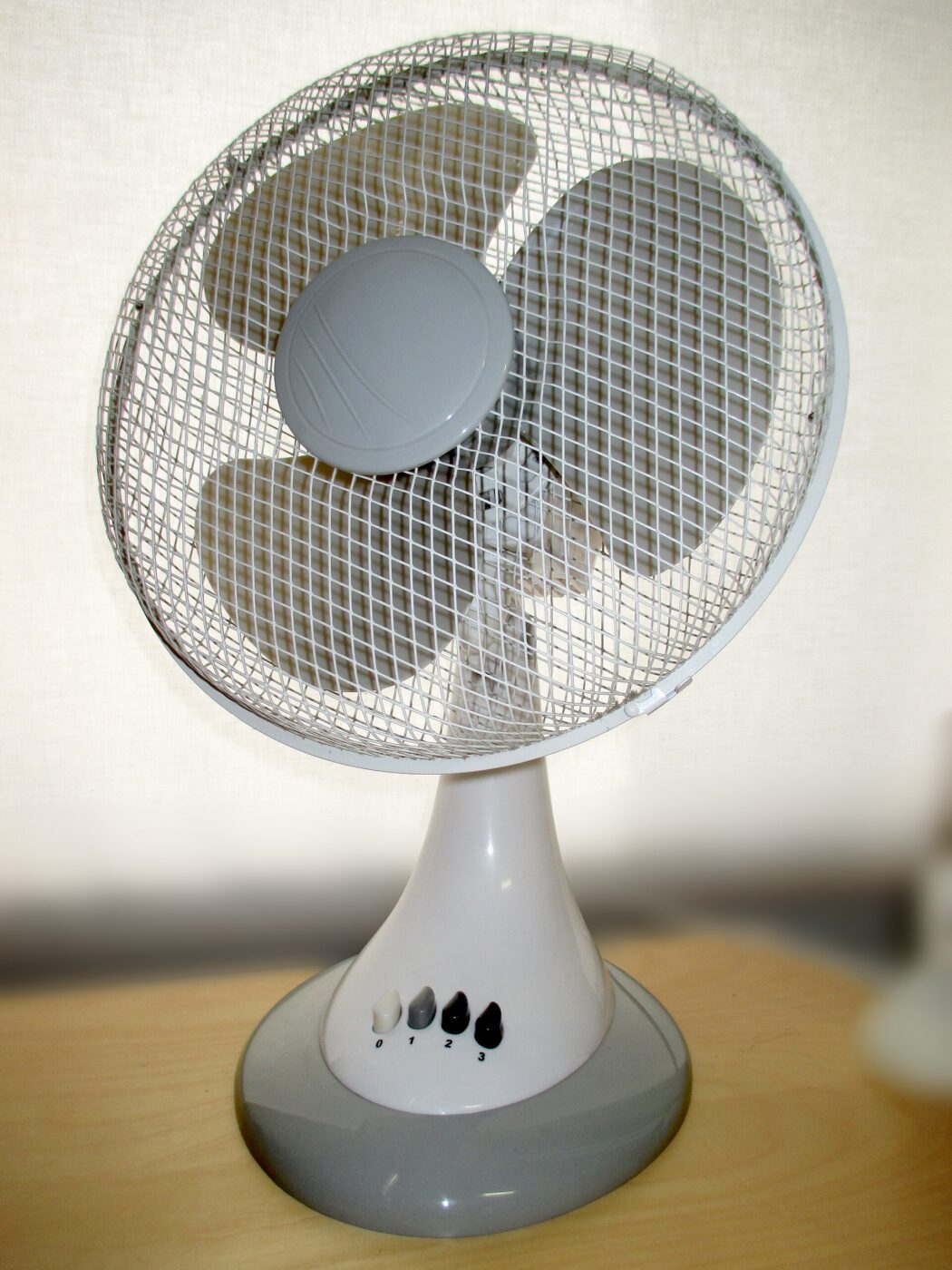 A small white table fan, the kind used in fan-based sound machines.